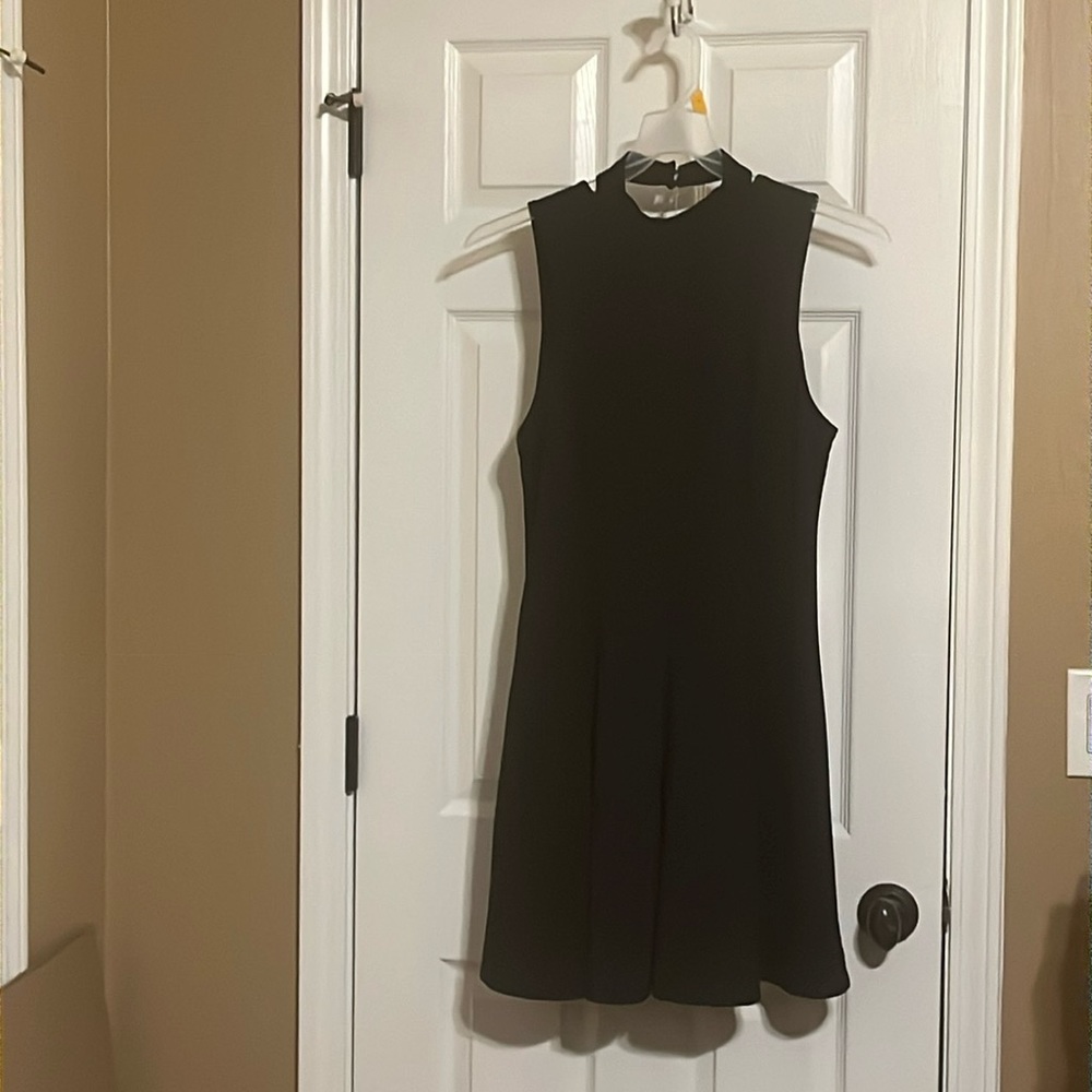 This Free People black dress is perfect for any event,  black knit, size large.